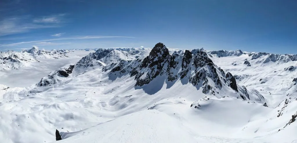 Back country ski tour on the Radüner Rothorn with a view of the Piz Radönt. Ski mountaineering skimo. Davos Klosters Switzerland. High quality photo