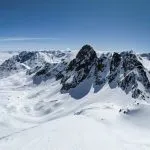Back country ski tour on the Radüner Rothorn with a view of the Piz Radönt. Ski mountaineering skimo. Davos Klosters Switzerland. High quality photo