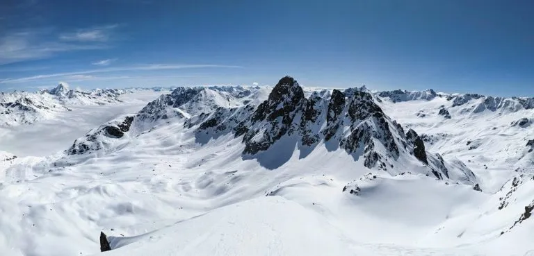 Back country ski tour on the Radüner Rothorn with a view of the Piz Radönt. Ski mountaineering skimo. Davos Klosters Switzerland. High quality photo