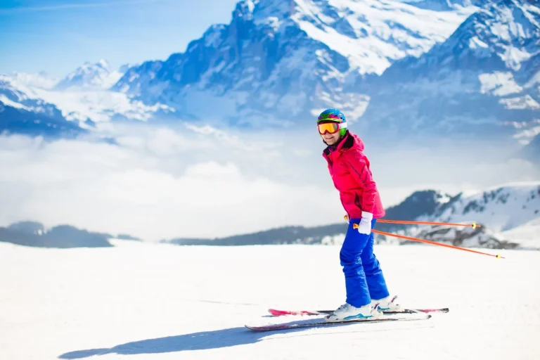Young woman skiing in the mountains.