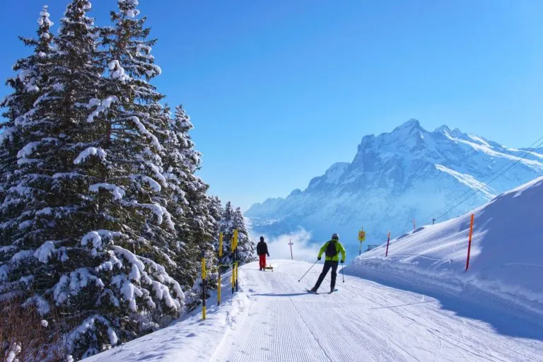 snow covered ski slopes in snowy winter in Swiss Alps